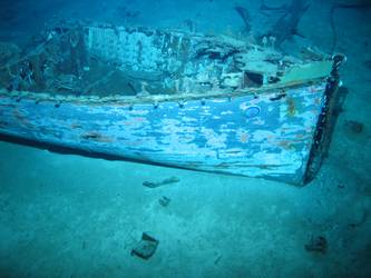 Carvel built motor boat. Note boat's helm in bottom